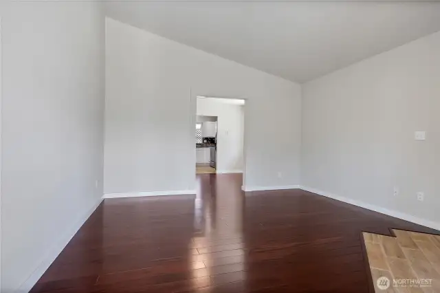 Living room looking towards kitchen and dining area.