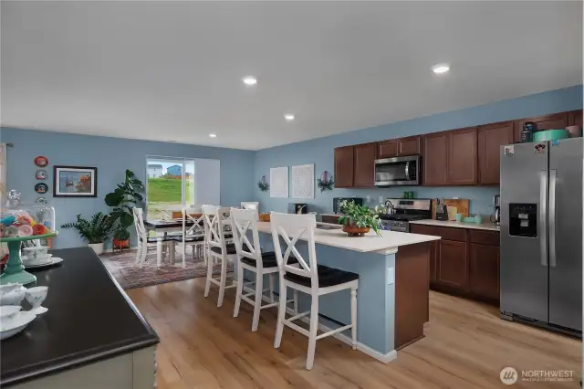 Large open-concept living space with quartz counters/over-sized island.