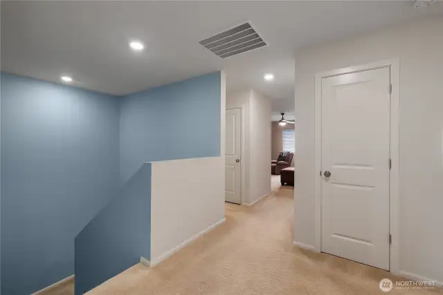Upstairs landing, bonus living space lies straight ahead - laundry space is directly to the left.