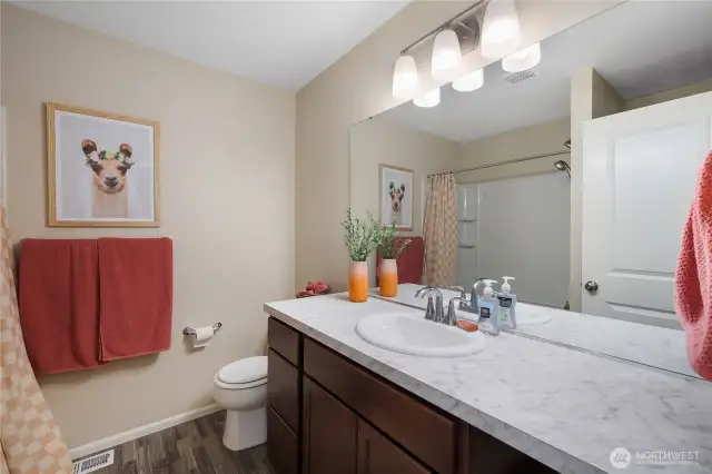 Full upstairs bathroom centrally located between all bedrooms and bonus space.