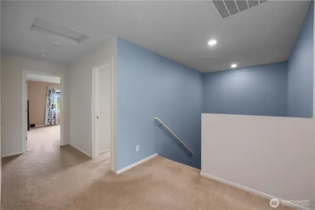 Alternate view from landing leading to Primary Bedroom straight ahead and 3rd upstairs bedroom to the right of primary.