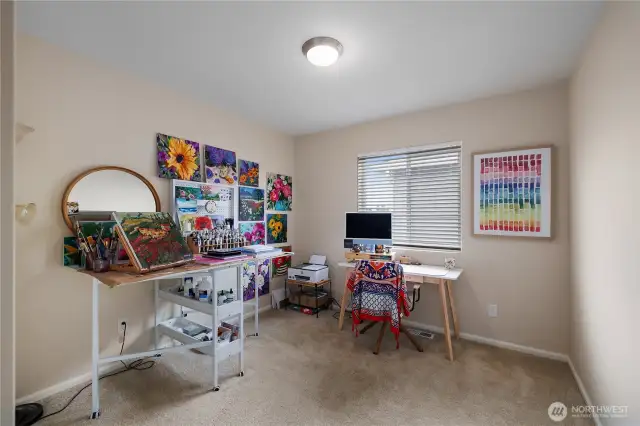 3rd upstairs bedroom is currently being used as an art studio.