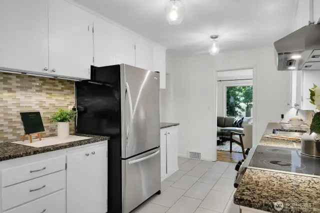 light bright and airy kitchen with lots of storage and counter space for all your culinary needs