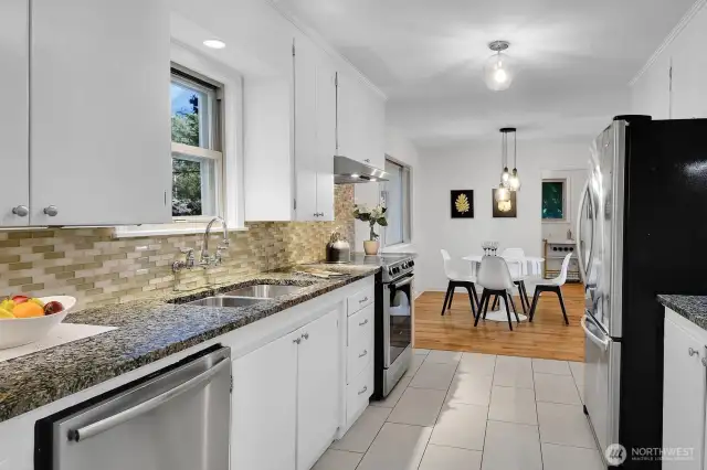 another view of the kitchen shows the dining area
