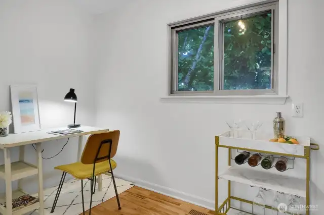 a view of the good sized flex space that can be used for a private office, walk-in pantry off of the kitchen, or both!