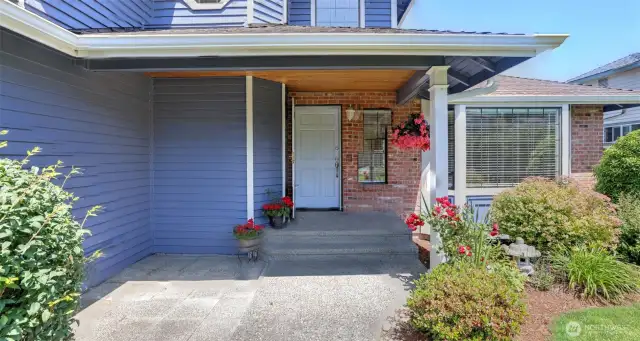 Covered Front Entry with extra patio out front!