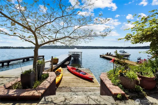 Charming 4 bed, 3.5 bath residence offers truly unrivaled views down the wide part of Lake Washington, Mount Rainier, the Olympics, twinkling lights of city skylines, golden sunsets, and endless maritime performances!