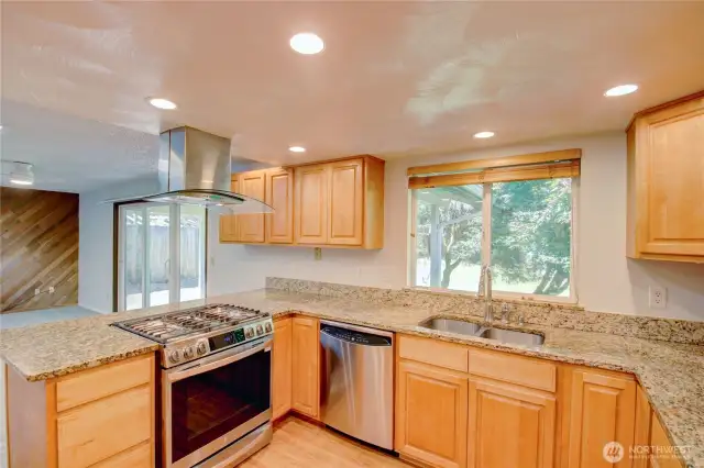 Spacious kitchen with granite counters and stainless appliances