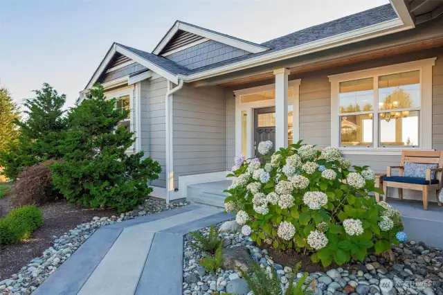 Peaceful entryway with a cozy front porch to watch the sun rise over Mt. Pilchuck