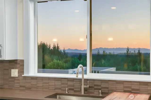 Views of the Olympics makes mundane tasks, like washing dishes, a bit more pleasant.