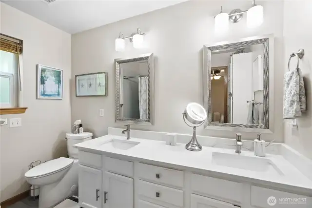Primary Bath updated with heated floors double sink and comfort height toilet.  Tub and Shower