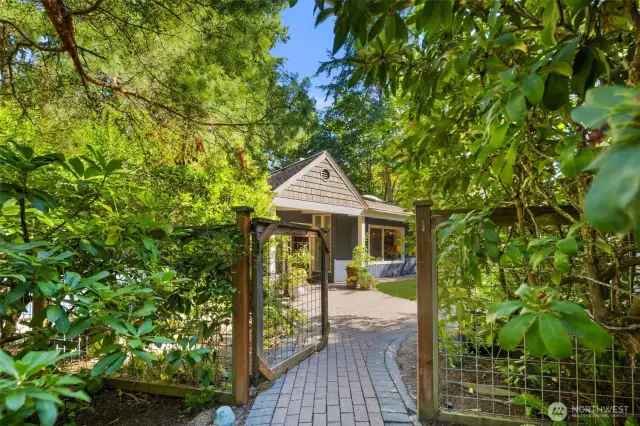 Inviting entry to this mid-century modern home on a corner lot in Wilburton