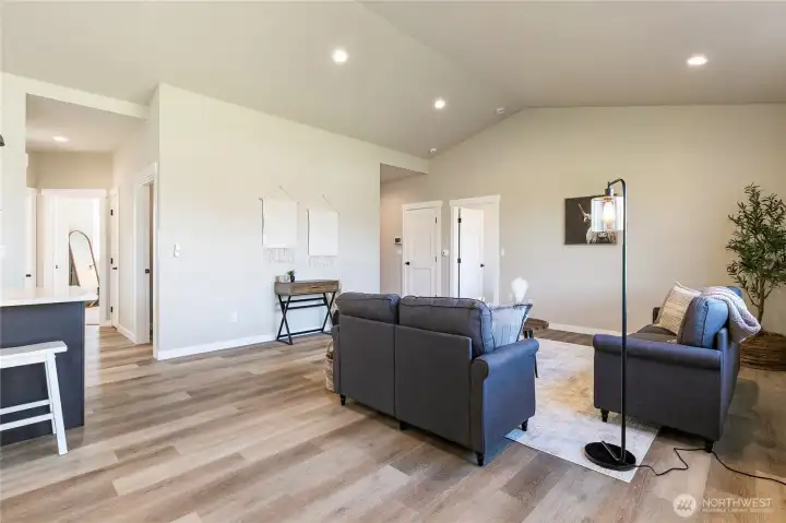 Vinyl plank flooring in the main area.