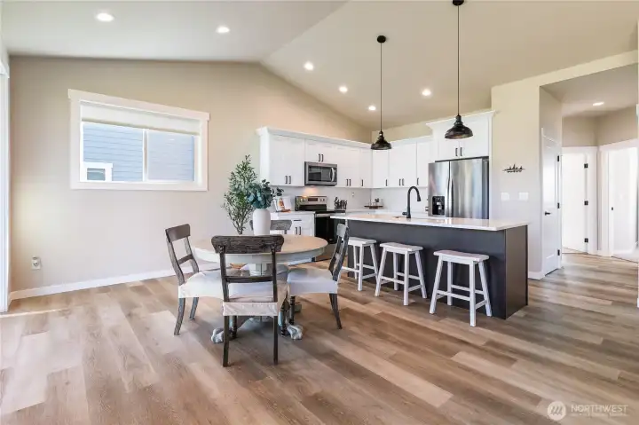 Dinning room area with additional seating at the kitchen island