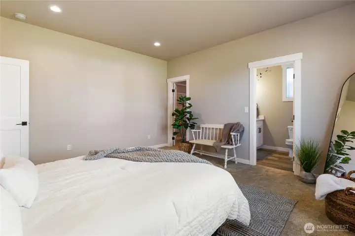Walk in closet to the left and 3/4 bathroom to the right