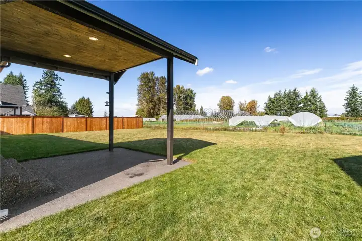 Covered patio to enjoy in the backyard looking north toward the canadian mountains