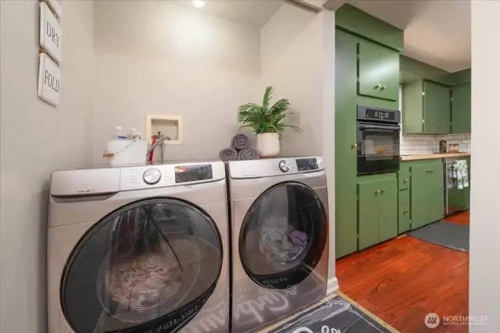 Washer and Dryer are to the left of the entery way.  You can add doors, shelves or keep it open.....you decide.