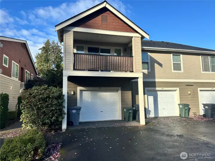 View from the back showing the deck and the garages below.