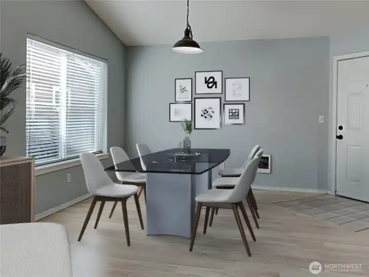 Dining area with big window and entrance in the background