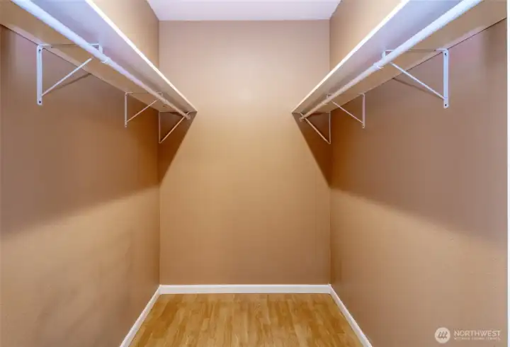 Primary bedroom walk in closet