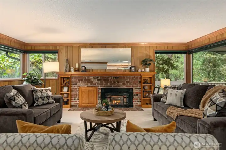 Cozy gas fireplace with brick surround and built-ins