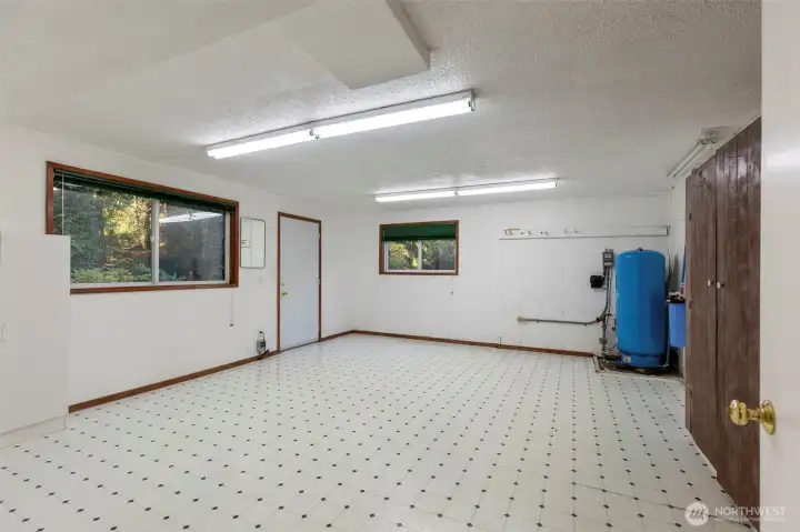 Downstairs large bonus, craft, family room with exterior entrance.