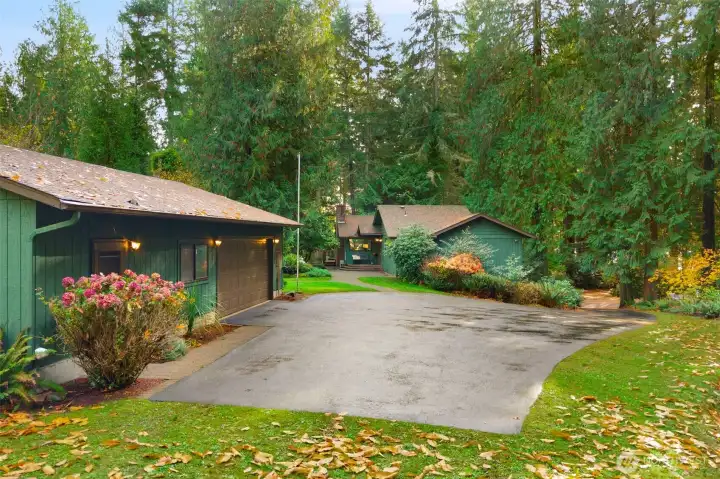 RV parking adjacent to garage with separate entrance office space with 1/2 bath & former dark room (easy kitchen conversion)