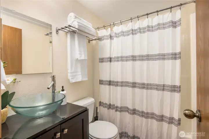 Second bath with tub between bedrooms 2 & 3.