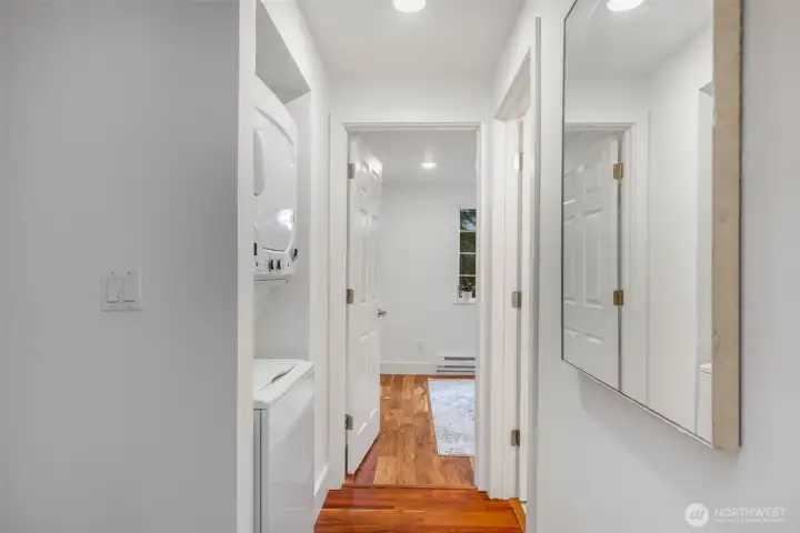 View towards 2nd br. 2nd bath on right and laundry on left