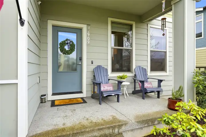 Charming covered front porch entry perfect for relaxing, welcoming guests, and enjoying the peaceful Ten Trails neighborhood in Black Diamond Washington.