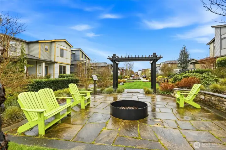Outdoor community fire pit and seating area ideal for entertaining, gathering with neighbors, and enjoying PNW evenings.