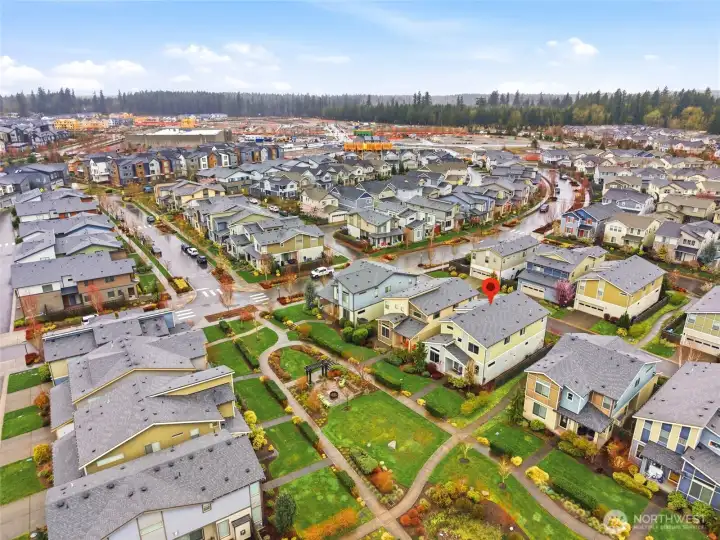 Expansive aerial view of Ten Trails showcasing community layout, parks, and surrounding natural beauty.