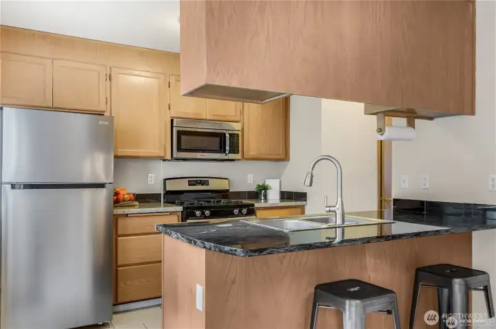 Kitchen with stainless steel appliances and lots of cupboards for storage