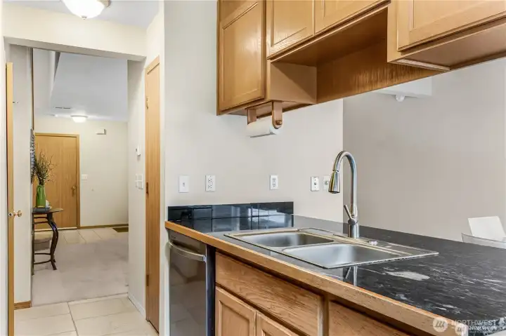 Kitchen area is open to dining room with entry to living room.