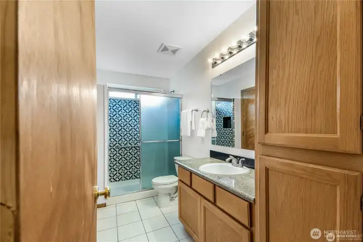 Updated tile shower in upstairs bathroom