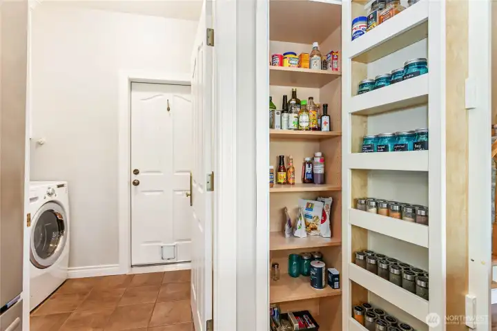 Spice cabinet, pantry closet in laundry room, door to garage Spice cabinet, pantry closet in laundry room, door to garage