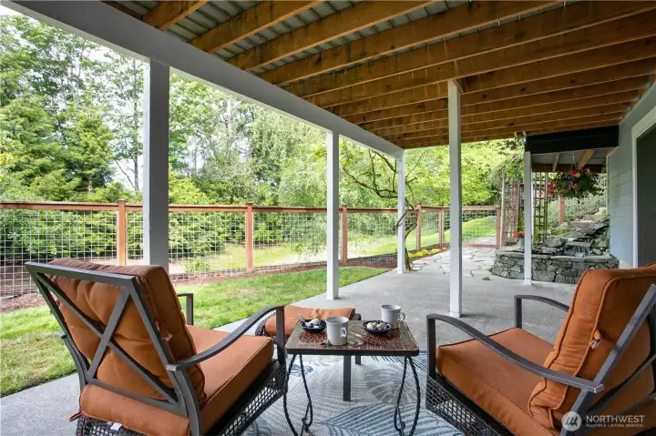 Downstairs covered patio with fishpond Downstairs covered patio with fishpond