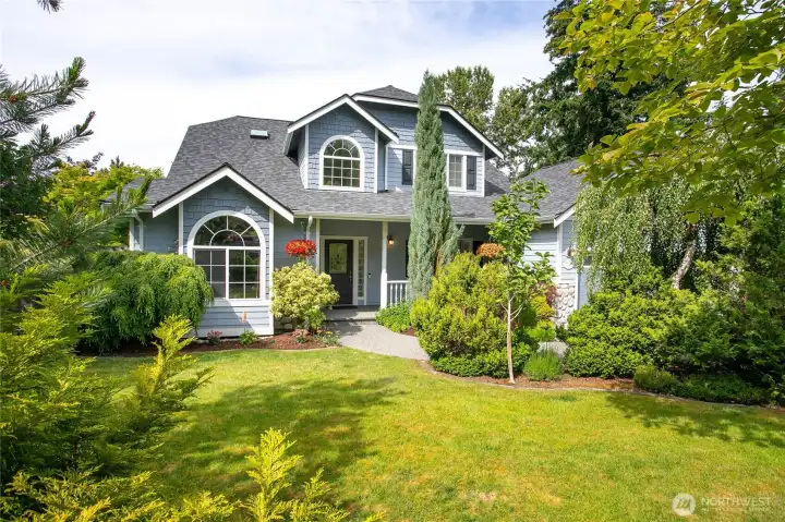 Private front yard with mature landscaping for privacy Private front yard with mature landscaping for privacy