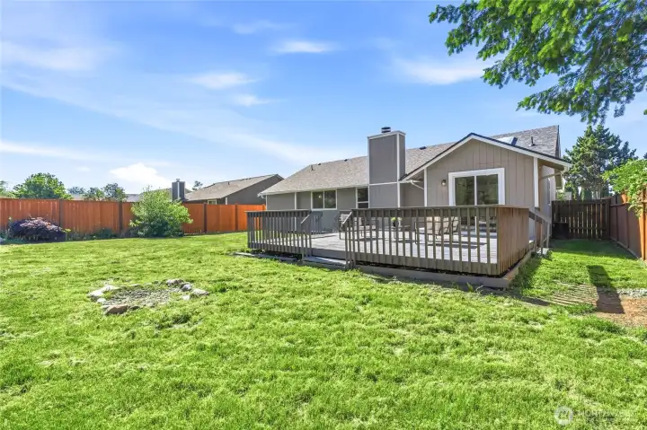 Updated Outdoor Living Space  Step out onto the updated deck, perfect for summer BBQs, morning coffee, outdoor dining, and entertaining guests all season long.