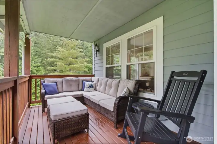 Sweet covered front deck overlooking the beautiful yard Sweet covered front deck overlooking the beautiful yard