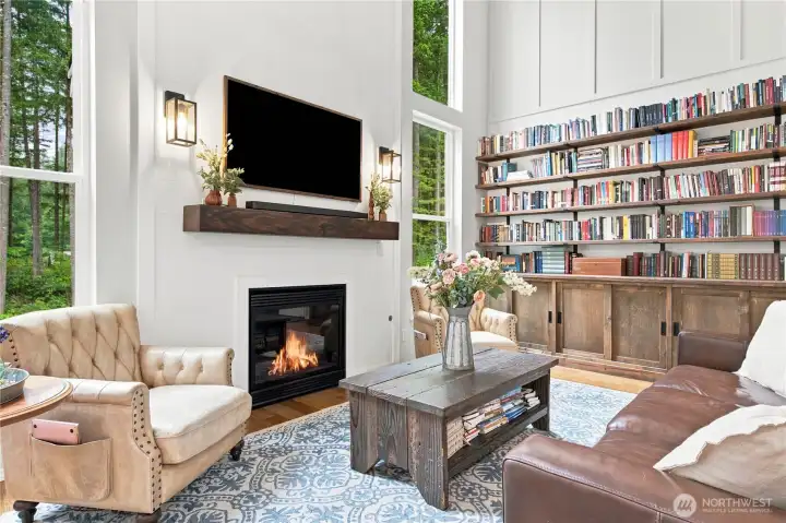 Soaring ceilings and cozy fireplace in the spacious living room with nice nautral light Soaring ceilings and cozy fireplace in the spacious living room with nice nautral light