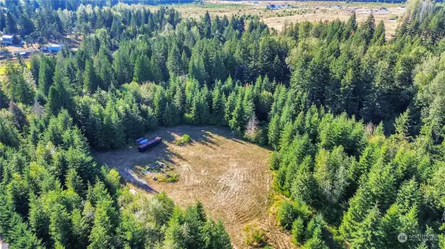 Building-site area of the 21 acres. Also the well site.  The container and vehicles will be removed. There is a separate driveway to this home site. This is the "Building/Home Site" area of the 21 acres.