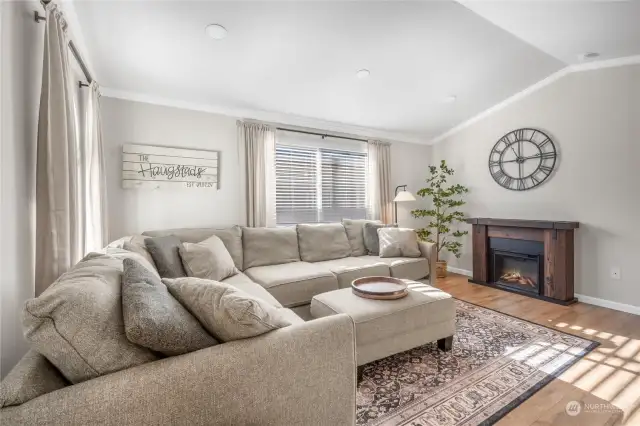 Ample size living room will fit large or multiple pieces of furniture. Cathedral ceilings, canned lighting.