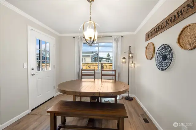 Notice the newer light fixture and windows allowing for more natural light.  This home's Floorplan & window placement allows for so much natural light which is such a nice feature to have in the PNW.