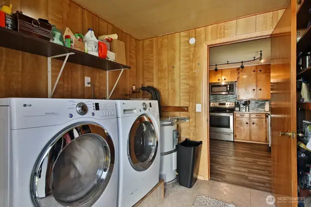 Utility Room with storage pantry, hot water heater and laundry.  All appliances included in sale.