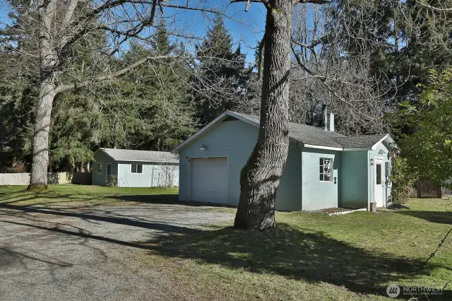 Garage space with off street parking area.  There is room to park an RV with all the level open space here!