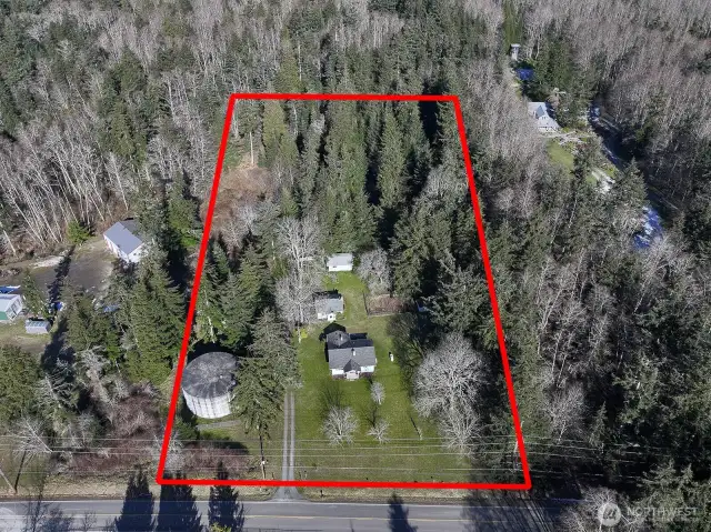 The property is screened with trees on three sides.  The round concrete structure is one of the Lagoon Point Community wells so there is an easement for well access and maintenance to that structure.