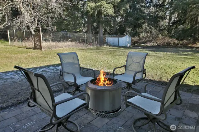 Back yard patio space with firepit.