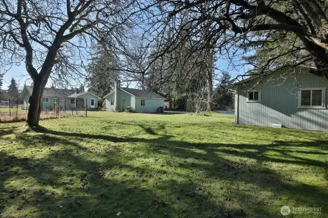 The detached garage has two bays, one with a garage door.  It would make a perfect wood shop with the woodstove.