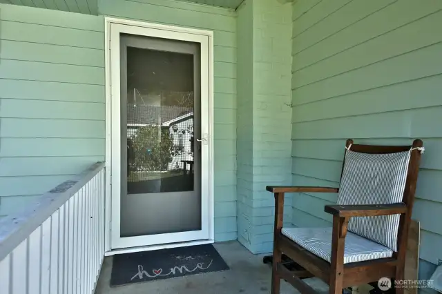 Covered entry at the rear of home enters through the kitchen.